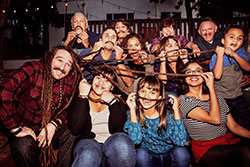 people holding moustaches in front of their face