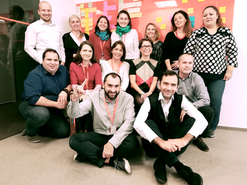 The tribe leads, product owners, chapter leads, Agile coaches and communications colleagues who are implementing the one WoW in Romania. Alina is standing third left.