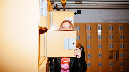 illustration: girl behind open locker door