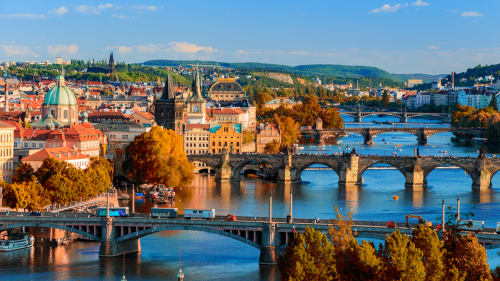 Vltava River and Charle bridge with red foliage - credits: DaLiu