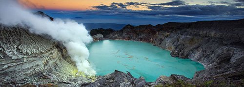 The Kawah Ijen volcano in East Java contains the world's largest acidic volcanic crater lake, called Kawah Ijen, famous for its turquoise colour. The active crater measures 950x600 meters and is known for its rich sulphur deposits, which are being quarried.