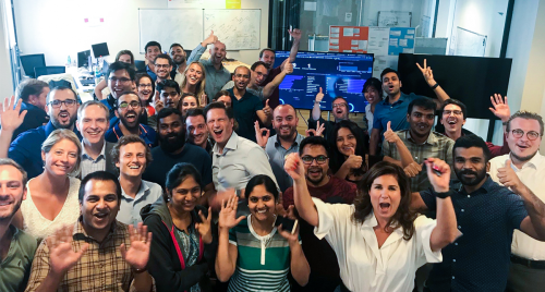 Paris office employees including the managing director of the ING AXA partnership, Suzanne Akten (front row with hands raised).