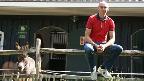 Marnix van der Velden at home with his solar panels (and donkey). 