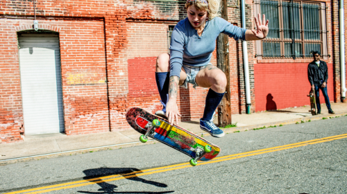 A  young woman skateboarding
